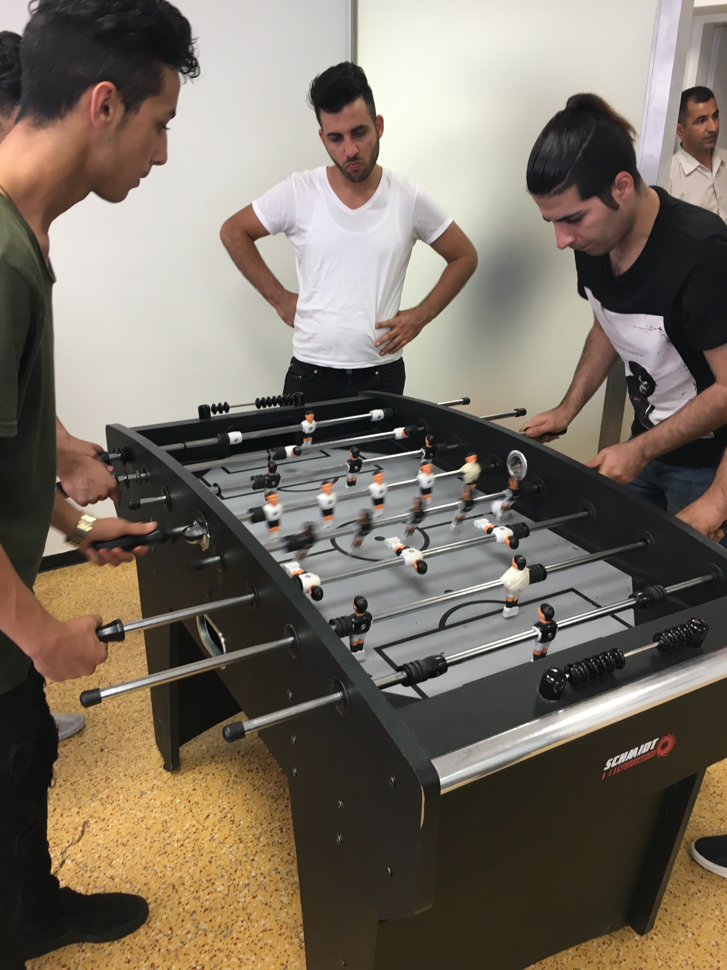 People playing foosball at The Meeting Place